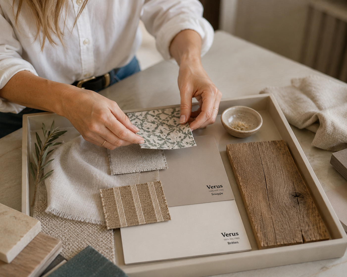 Interior design mood board featuring Verus Paint peel & stick samples, fabric swatches, wood finishes and hardware used to plan a room scheme.